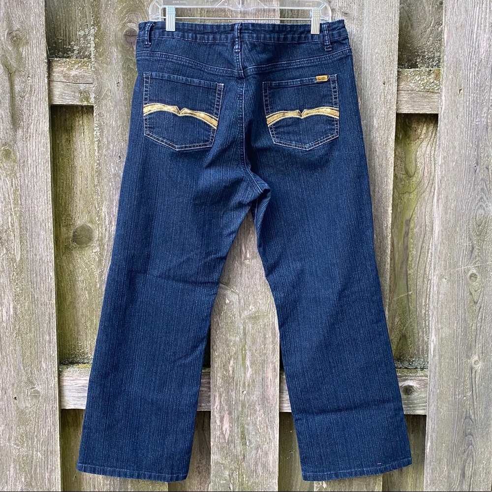 Bootcut dark blue stretch jeans with sequins on back pockets
